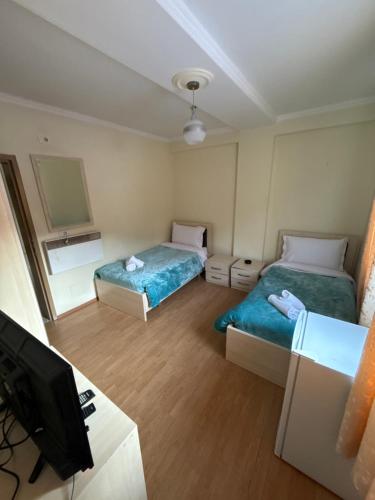 Ein Bett oder Betten in einem Zimmer der Unterkunft Bar-Hotel IRDI