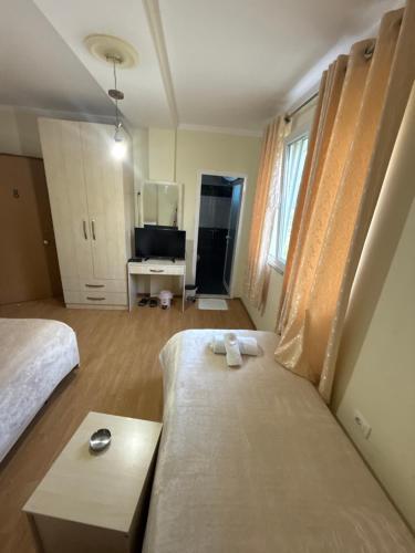 Ein Bett oder Betten in einem Zimmer der Unterkunft Bar-Hotel IRDI