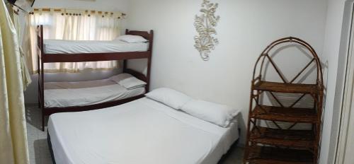 Postel nebo postele na pokoji v ubytování Hotel Palma Paraíso