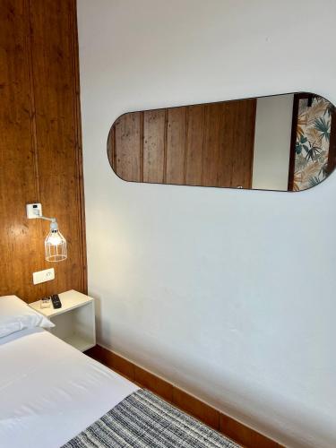 Ένα ή περισσότερα κρεβάτια σε δωμάτιο στο Hostal Real