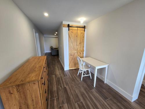 a room with a desk and a table and a door at Wheel chair Access, Private Boat Launch in Roseneath
