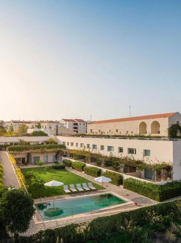 an aerial view of a resort with a swimming pool at Casa do Convento in Tavira