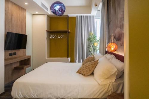 Una cama o camas en una habitación de Design Hotel Astra B&B