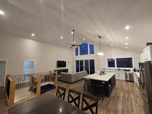 a large kitchen and living room with a table at Wheel chair Access, Private Boat Launch in Roseneath