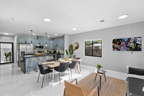 a kitchen and dining room with a table and chairs at Spacious 4-BR House W Free Parking in Miami