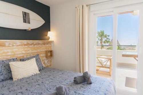 Postel nebo postele na pokoji v ubytování Tarifa Cozy House - Old Surf