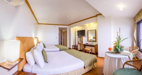 Ένα ή περισσότερα κρεβάτια σε δωμάτιο στο Hotel Olé Caribe