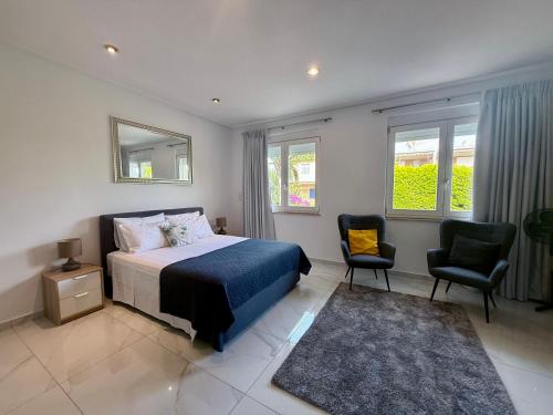 A bed or beds in a room at Villa 56 Luxury apartments