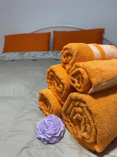 a pile of towels sitting on top of a bed at Via Roma 55 in Lipari
