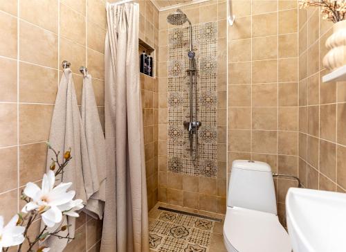 a bathroom with a shower and a toilet at Lovely nest in Nõmme in Tallinn