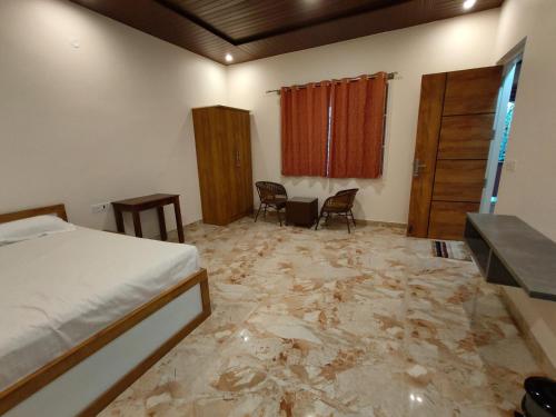 a bedroom with a bed and a marble floor at Tropica Retreat by Dazzle Destinations - Private Waterfalls, Private Rooms and Bonfire in Aldūr