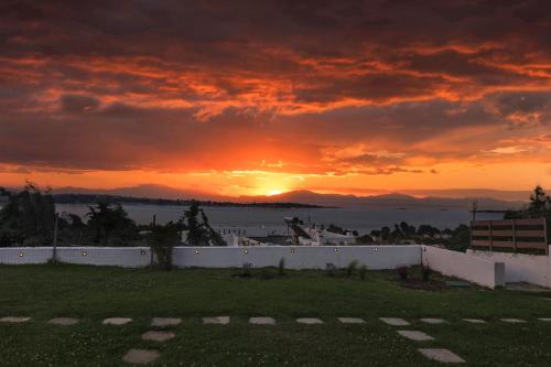 a sunset from the roof of a building at Panorama Dream Studios B in Vourvourou