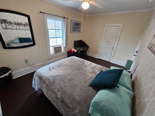 a bedroom with a bed and a window at Wilmington Classic Next To Downtown in Wilmington