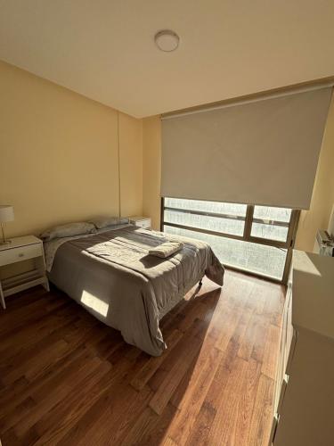 En eller flere senge i et værelse på Apartamentos Sur RG