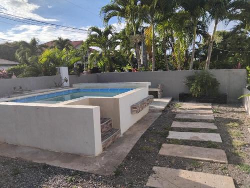 a swimming pool in the backyard of a house at The Studio apartment at Csompó Silver Manor in Kupuis