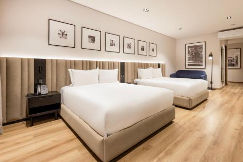 Un ou plusieurs lits dans un hébergement de l'établissement Vuestro Hotel Boutique