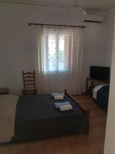 Postel nebo postele na pokoji v ubytování DORA'S HOUSE Douneika