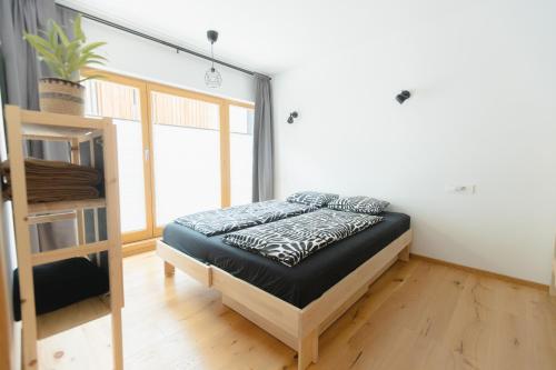 a bedroom with a bed in a room at Nordic House Apartment A1 in Kranjska Gora