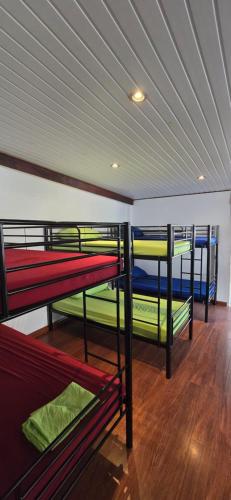 a group of bunk beds in a room at SelfStay Inn Faaa in Faaa
