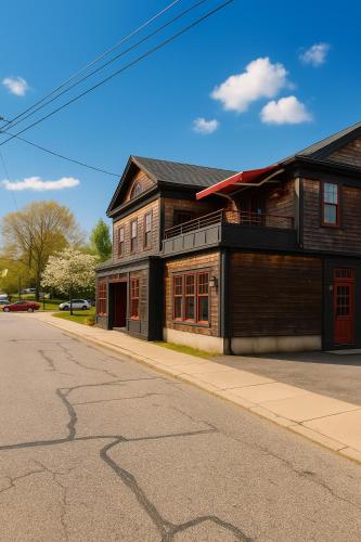 an old building on the side of a street at Magical Post And Beam Loft Downtown Newport! in Newport