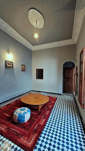 a room with a table in the middle of a room at Riad Dar Bahija Fes in Fès