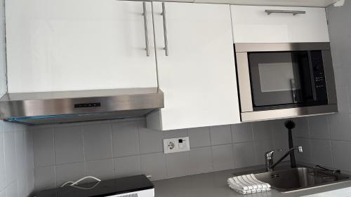 A kitchen or kitchenette at Apartments Paradise Lloret