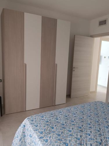 Ένα ή περισσότερα κρεβάτια σε δωμάτιο στο Casa Nonna Marì