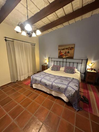 a bedroom with a bed in the middle of it at Establecimiento Don Elder in Sunchales