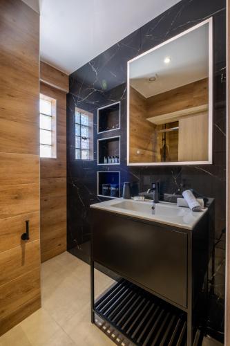 a bathroom with a sink and a mirror at Agora Views in Athens