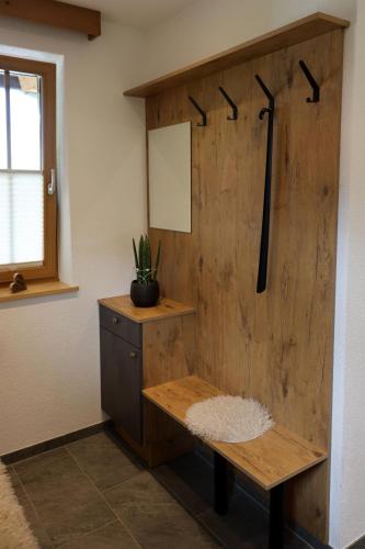 a wooden wall with a bench in a room at Alpenchalet Eiter in Arzl im Pitztal