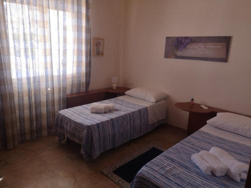 Postel nebo postele na pokoji v ubytování Casa Cortileverde