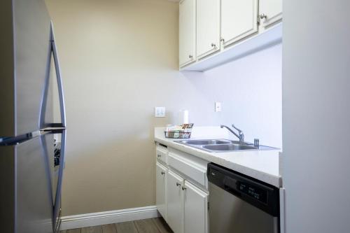 a kitchen with a sink and a refrigerator at Indian Palms Vacation Club in Indio