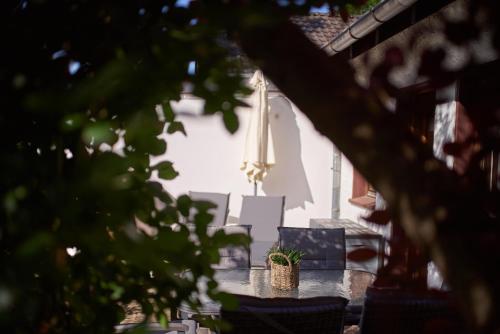 a table with a potted plant on top of it at Ferienhaus am Spiegelberg in Lemgo in Lemgo