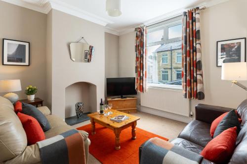 a living room with two couches and a table at AIRE VUE - Skipton in Skipton