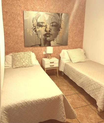 Ένα ή περισσότερα κρεβάτια σε δωμάτιο στο Formentera Suite 6