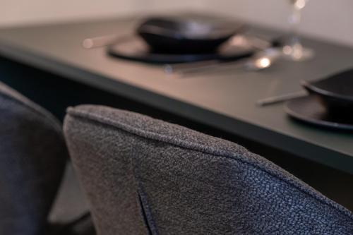 a close up of the back of a chair in front of a counter at Agora Views in Athens