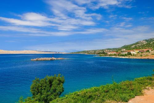 an island in the middle of a large body of water at Apartments Bono in Karlobag