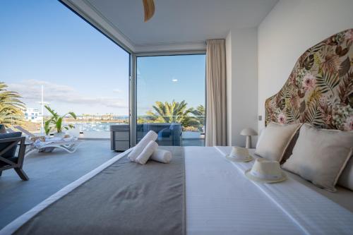 Postel nebo postele na pokoji v ubytování Sabbia Suites Infinity