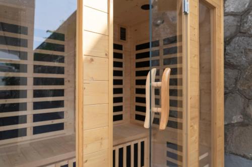 a wooden sauna with a chair inside of it at Stabiae Suite&Spa Sorrento Coast Suites in Castellammare di Stabia