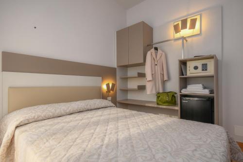 Postel nebo postele na pokoji v ubytování Hotel Riel
