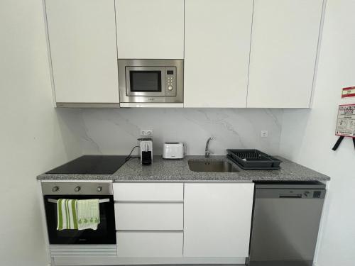 Kuchyň nebo kuchyňský kout v ubytování Loft Das Rocas