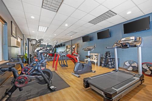 a gym with several exercise bikes and treadmills at Best Western Plus City Center in Spokane