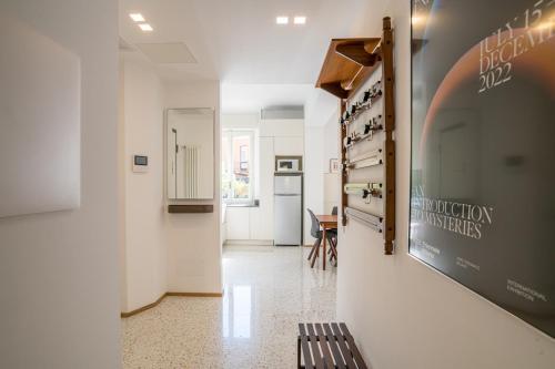 a hallway of a building with a sign on the wall at Central Cernobbio - Modern apartment in Cernobbio