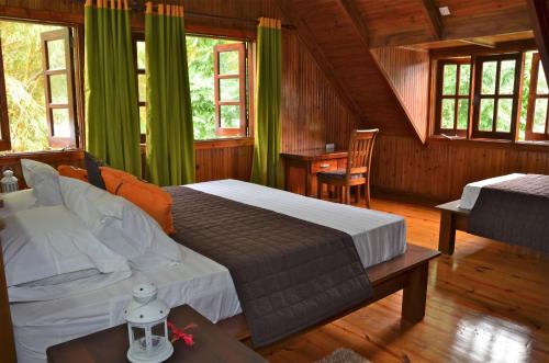 Säng eller sängar i ett rum på Villa Pasyon
