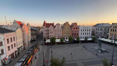 a view of a city with buildings and a street at Long Island in Grudziądz