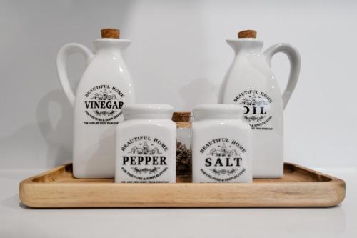 a tray with three milk bottles and pepper salt at Luxury 2BR 2BTH Suite 5 Mins to The Falls Sleeps 6 in Niagara Falls
