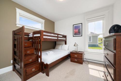 a bedroom with a bunk bed and a dresser at The Marmot - 12 Butternut in Cherry Valley