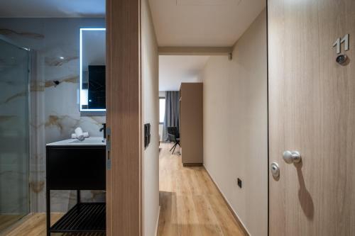 a bathroom with a sink and a mirror at Agora Views in Athens