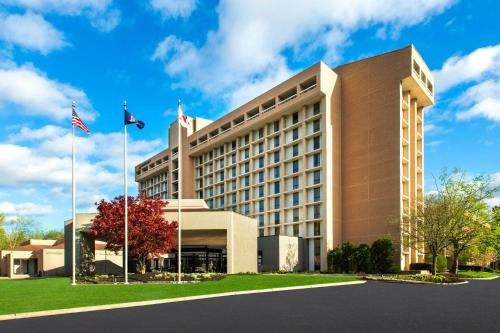 a hotel building with two flags in front of it at Westchester Marriott in Tarrytown