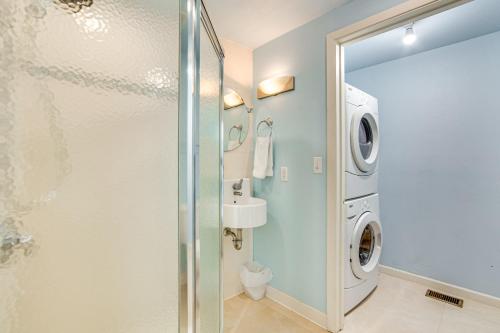 a bathroom with a shower and a washing machine at Waterfront Gem on Cedar Creek Lake with Deck and Games in Enchanted Oaks